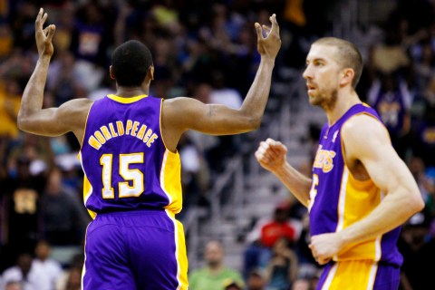 Los Angeles Laker Metta World Peace reacts after hitting a three-pointer during a Lakers game against the New Orleans Hornets  in New Orleans