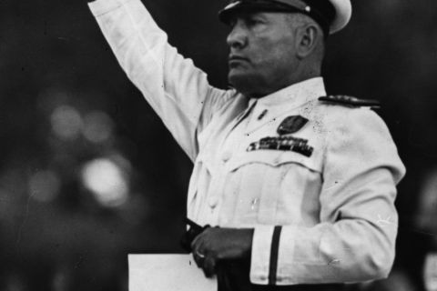 5th July 1939:  Benito Mussolini (1883 - 1945) taking the salute at a demonstration held by Italian firemen in Rome. 