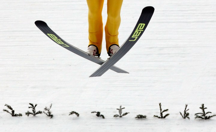 Finland's Mikke Leinonen lands during a men's nordic combined training session at the 2014 Winter Olympics, Tuesday, Feb. 11, 2014. 